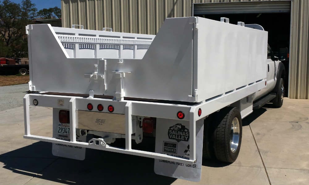 Custom removable aluminum side doors on a white flatbed truck